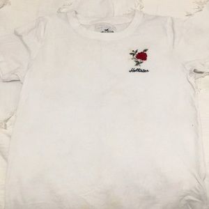 This white shirt with a red rose is from Hollister.